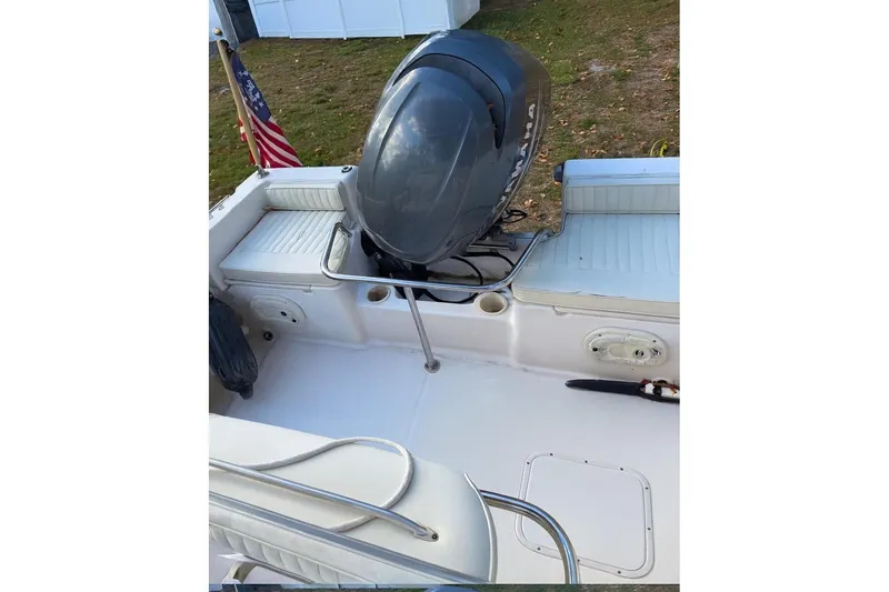 Slide: The Image of 2004 Grady-White Fisherman 180 boat with Yamaha outboard motor and American flag. - 4