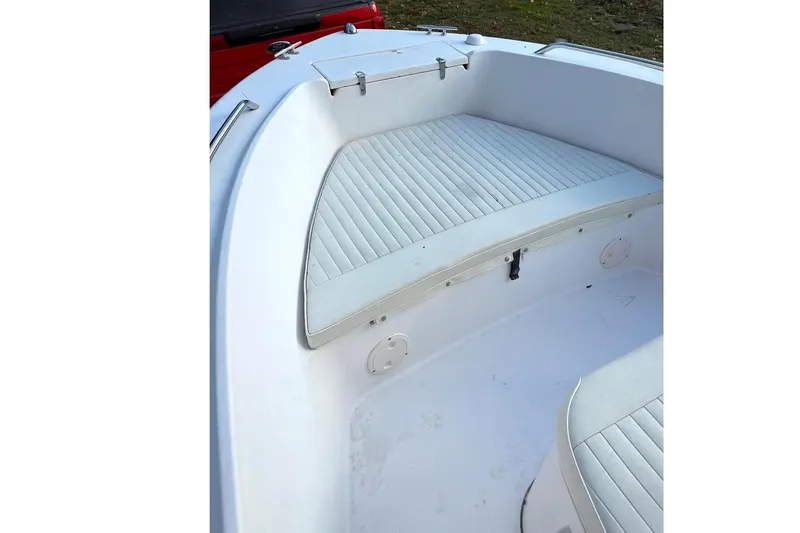 Slide: The Image of 2004 Grady-White Fisherman 180 boat interior with cushioned seating. - 5