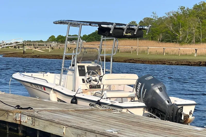 Slide: The Image of 2004 Grady-White Fisherman 180 boat docked by a scenic waterfront. - 7