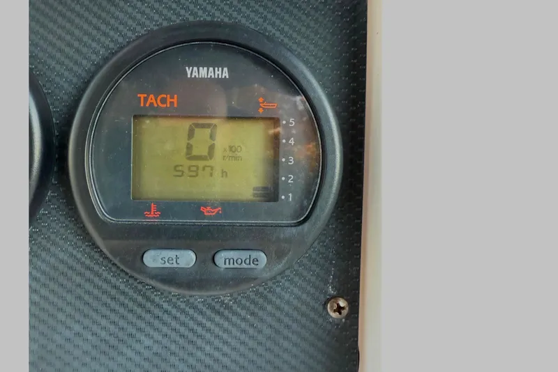 Slide: The Image of Yamaha tachometer displaying 597 hours on a 2004 Grady-White Fisherman 180 boat. - 8