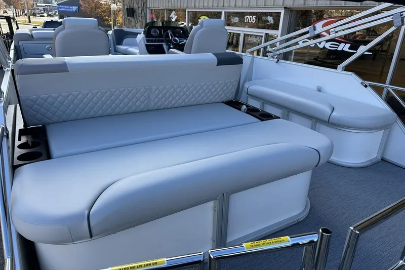 Slide: The Image of 2026 Godfrey Sweetwater 2286 SFLC pontoon boat interior with plush seating and cup holders. - 4