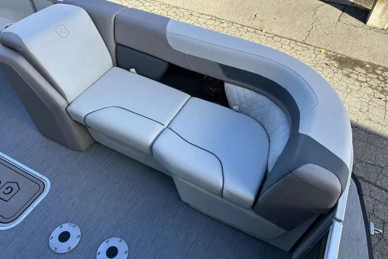 Slide: The Image of 2026 Godfrey Sweetwater 2286 SFLC boat seating with gray and white upholstery. - 8