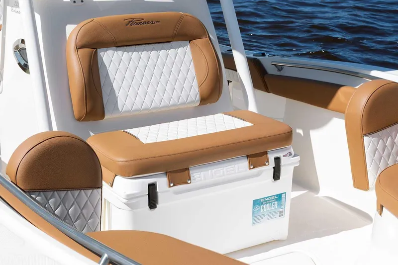 Slide: The Image of Manufacturer Provided Image: 2025 Pioneer 222 Islander boat interior with tan and white seating, Engel cooler. - 10