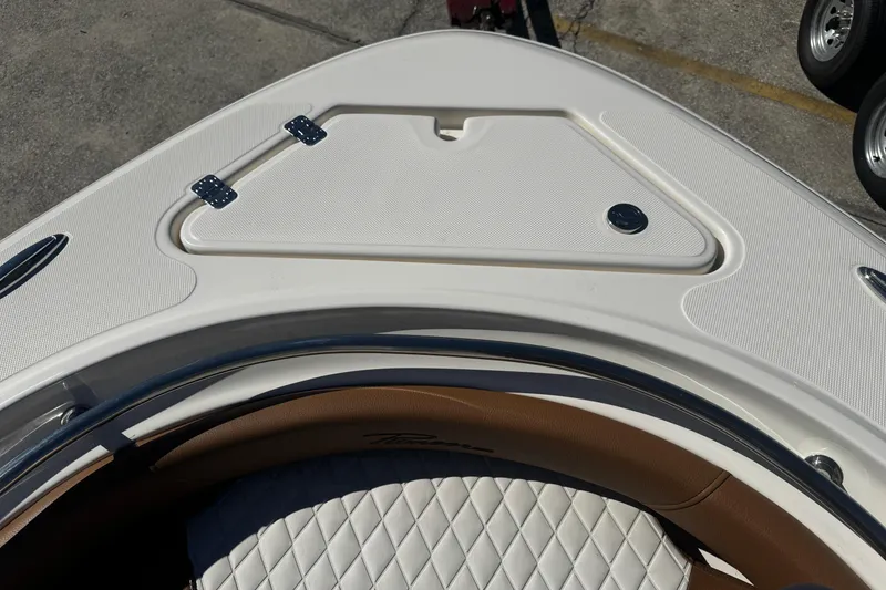 Slide: The Image of 2026 Pioneer 222 Islander boat bow with storage compartment and quilted seating. - 26