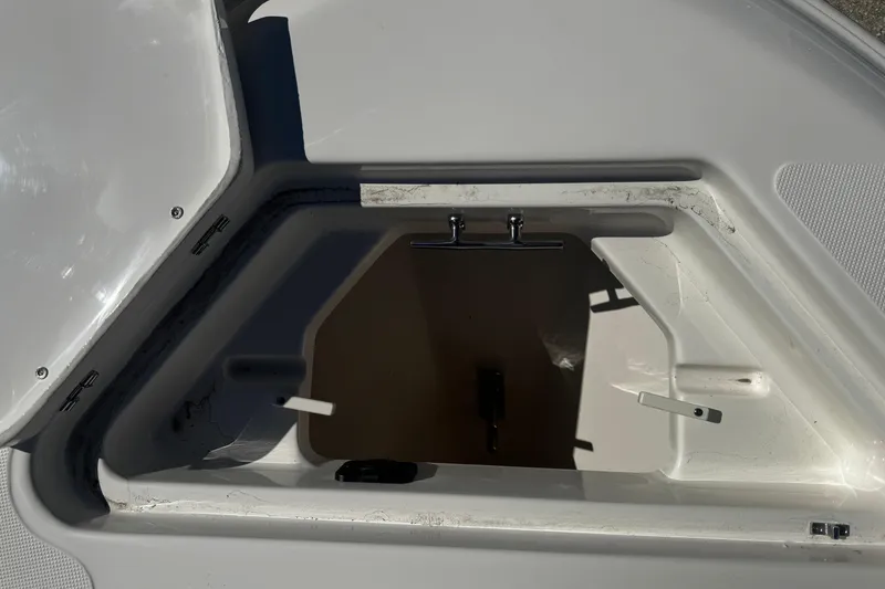 Slide: The Image of Open storage compartment on 2026 Pioneer 222 Islander boat, showcasing interior details. - 27