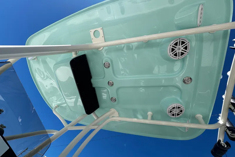 Slide: The Image of Underside view of 2026 Pioneer 222 Islander boat canopy with speakers and blue sky background. - 35