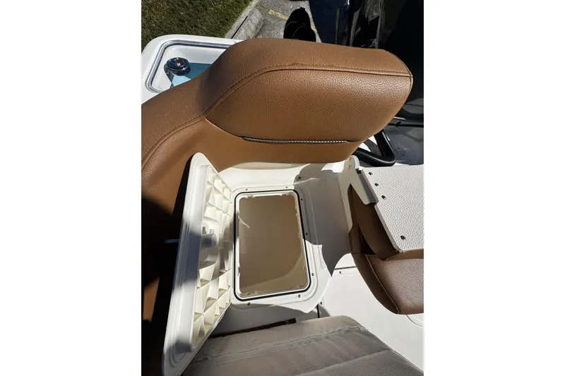 Slide: The Image of 2026 Pioneer 222 Islander boat seat with open storage compartment. - 39