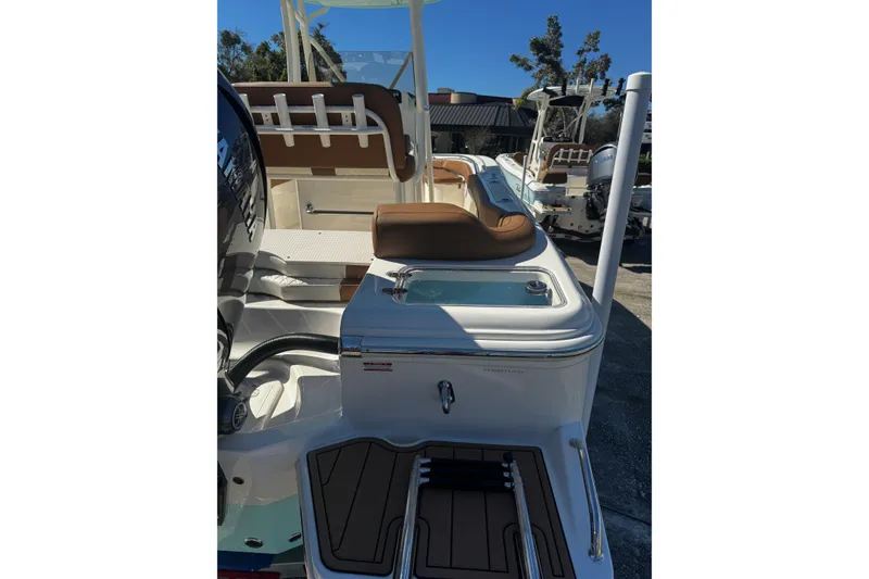 Slide: The Image of 2026 Pioneer 222 Islander boat with brown seating and sleek design. - 8