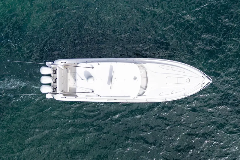 Slide: The Image of Aerial view of 2019 Intrepid 407 Cuddy boat on open water. - 11