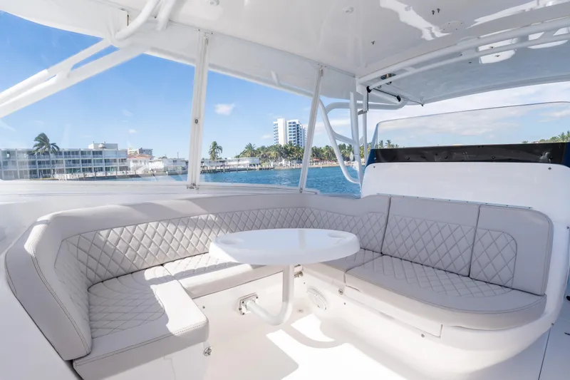 Slide: The Image of Luxurious seating area on 2019 Intrepid 407 Cuddy boat with ocean view. - 31