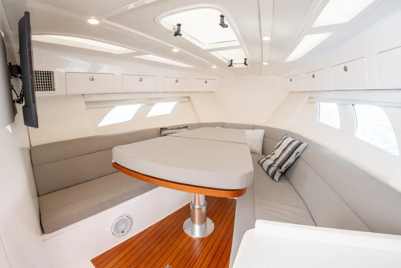 Slide: The Image of Luxurious interior of 2019 Intrepid 407 Cuddy boat with elegant seating and table. - 34