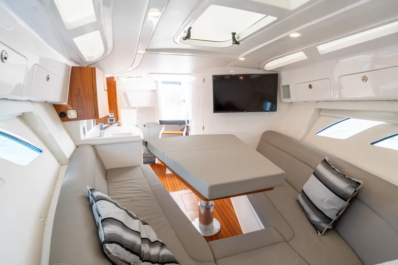 Slide: The Image of Luxurious interior of 2019 Intrepid 407 Cuddy boat with modern seating and entertainment system. - 36