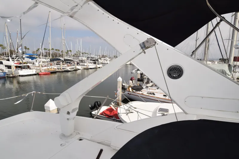 Slide: The Image of 1999 Bayliner 5288 yacht docked in a marina with other boats. - 21