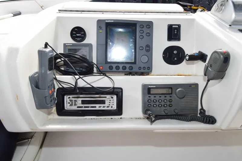 Slide: The Image of Control panel of a 1999 Bayliner 5288 yacht with navigation and communication equipment. - 22