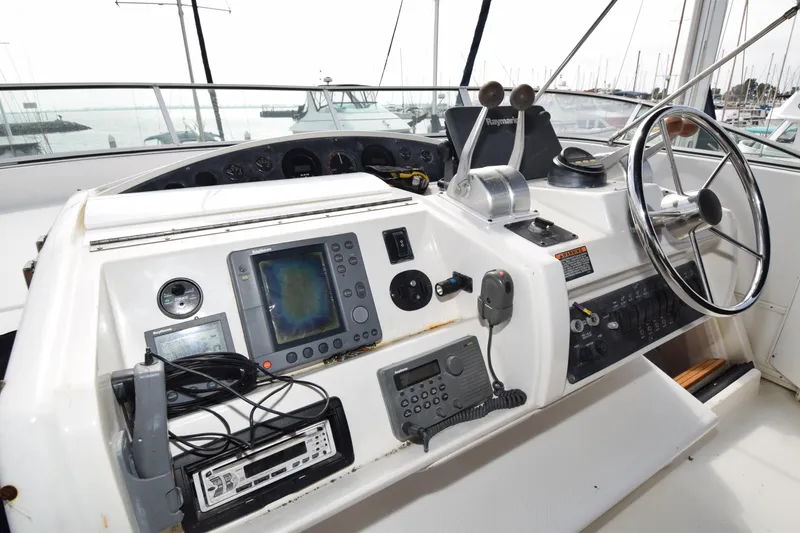 Slide: The Image of 1999 Bayliner 5288 yacht helm with navigation equipment and steering wheel. - 23