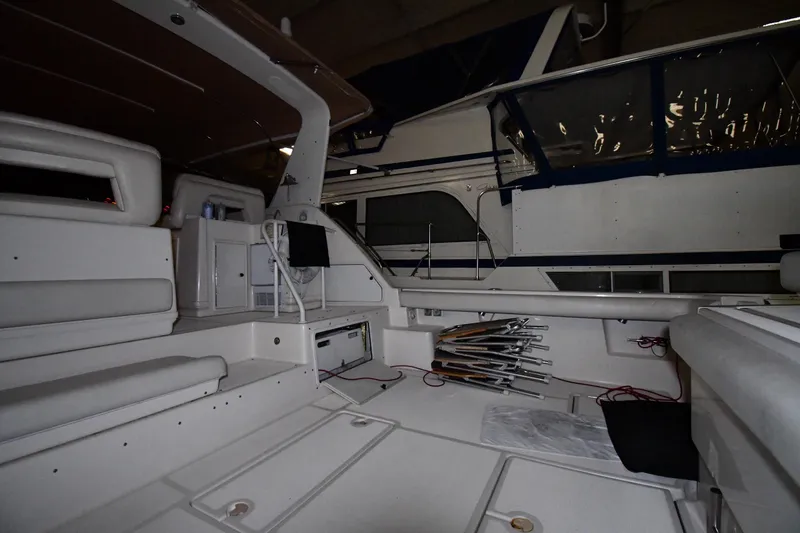 Slide: The Image of 1994 Tiara Yachts 4300 Open interior with seating and storage compartments. - 14