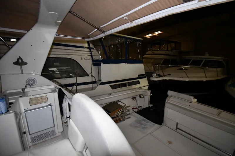 Slide: The Image of 1994 Tiara Yachts 4300 Open interior view in a dimly lit storage area. - 17