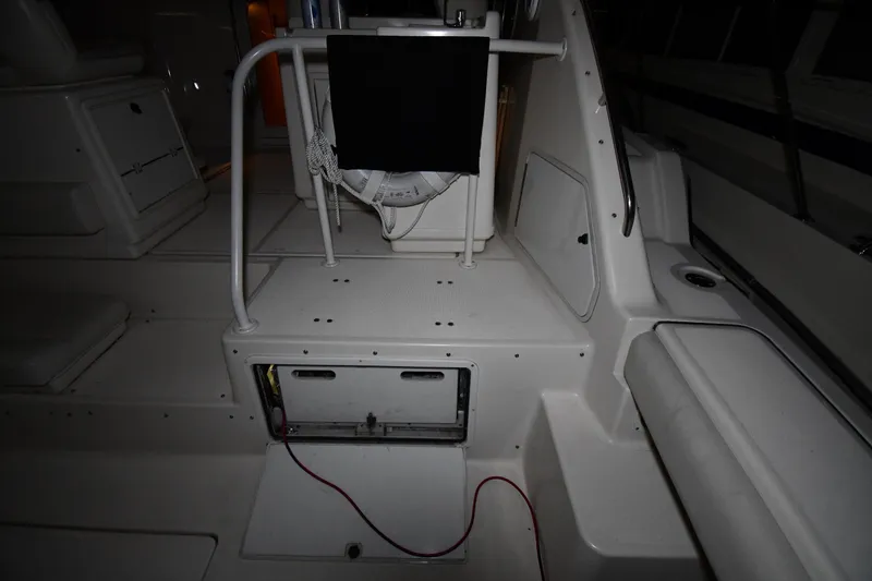 Slide: The Image of 1994 Tiara Yachts 4300 Open interior with seating and storage compartments. - 19