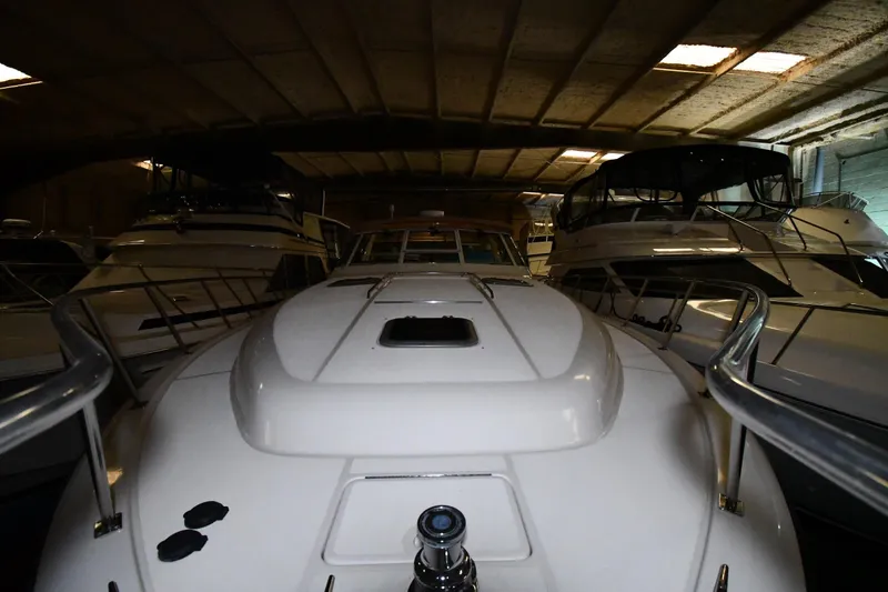 Slide: The Image of 1994 Tiara Yachts 4300 Open in a dimly lit storage facility. - 2