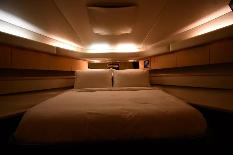 Slide: The Image of Luxurious cabin interior of 1994 Tiara Yachts 4300 Open with cozy bedding. - 22