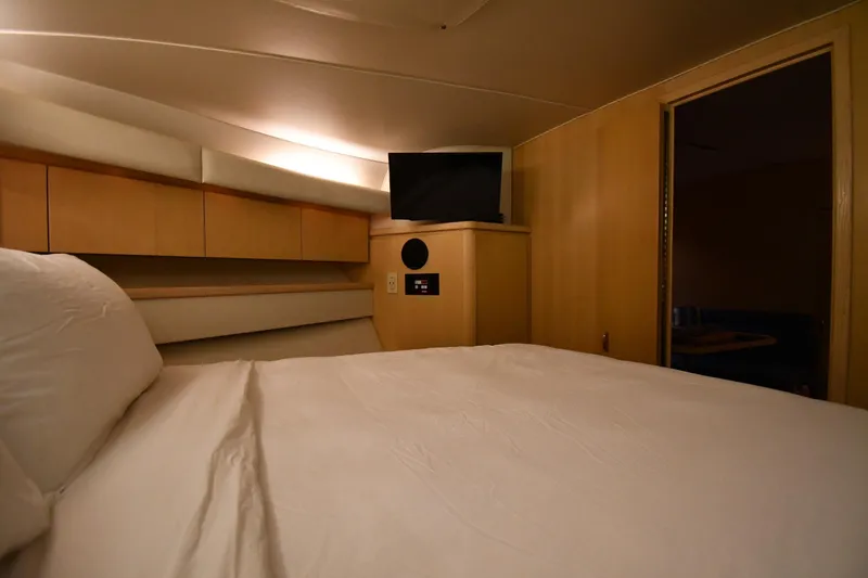 Slide: The Image of 1994 Tiara Yachts 4300 Open cabin interior with bed and TV. - 26