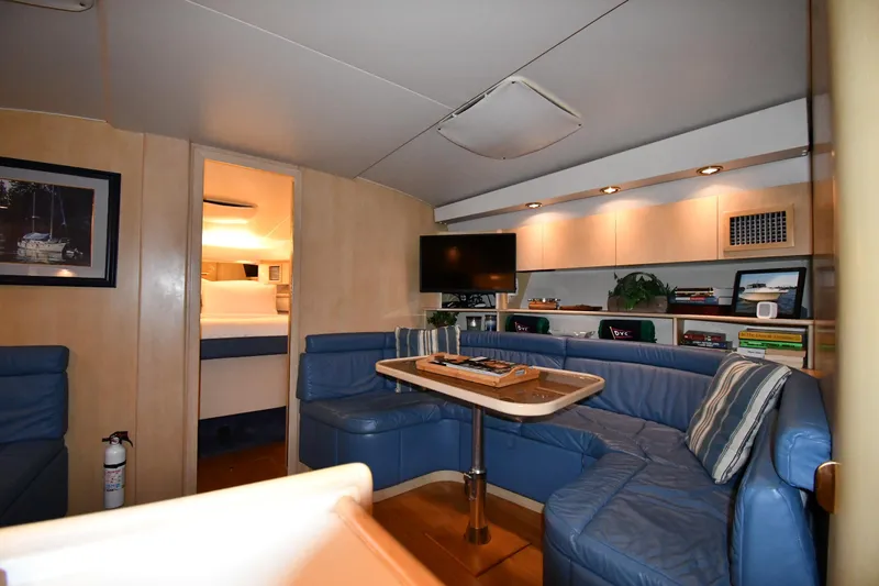 Slide: The Image of Luxurious interior of 1994 Tiara Yachts 4300 Open with blue seating and modern amenities. - 27