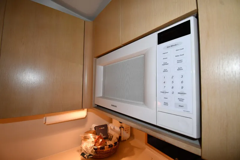 Slide: The Image of Built-in Samsung microwave in a 1994 Tiara Yachts 4300 Open kitchen area. - 33
