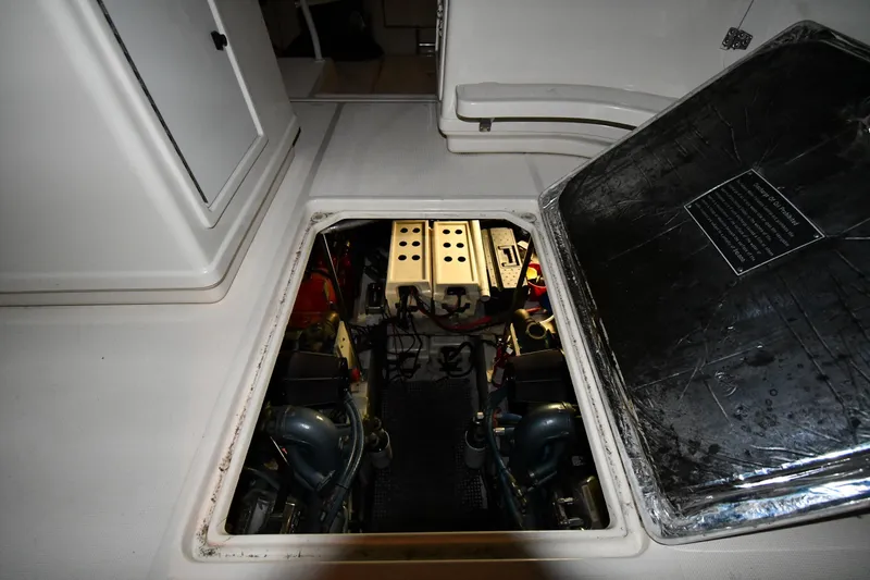 Slide: The Image of Engine compartment of a 1994 Tiara Yachts 4300 Open, showcasing mechanical components. - 41