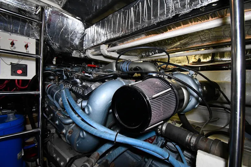Slide: The Image of Engine room of 1994 Tiara Yachts 4300 Open, showcasing complex machinery and components. - 42