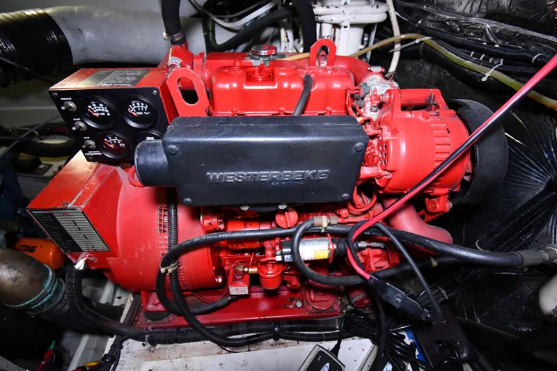 Slide: The Image of Engine compartment of a 1994 Tiara Yachts 4300 Open, featuring a Westerbeke generator. - 47