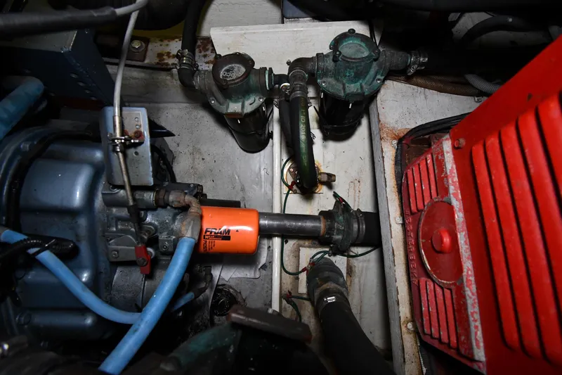 Slide: The Image of Engine compartment of a 1994 Tiara Yachts 4300 Open, featuring mechanical components. - 49