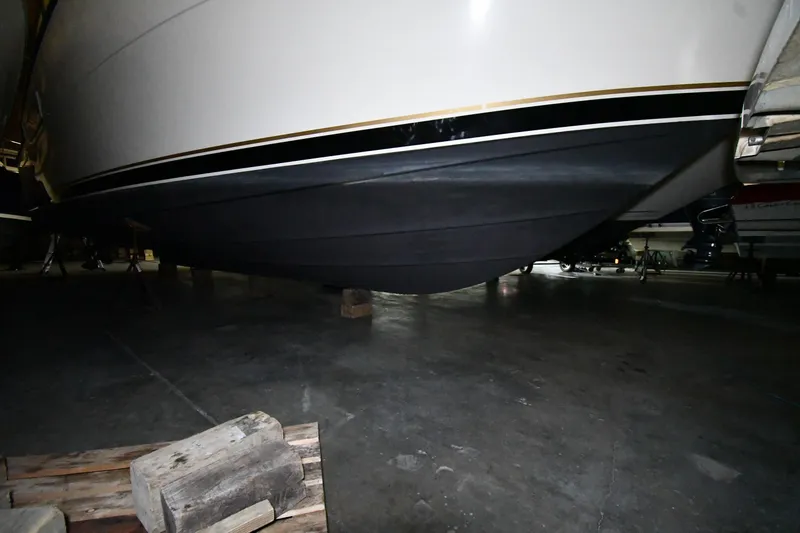 Slide: The Image of 1994 Tiara Yachts 4300 Open hull in storage, showcasing sleek design and craftsmanship. - 52