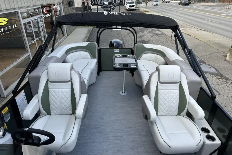 Slide: The Image of 2026 Godfrey Sweetwater 2286 SBC pontoon boat with luxurious seating and modern design. - 10