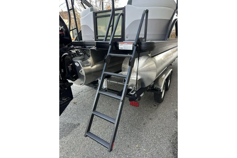 Slide: The Image of 2026 Godfrey Sweetwater 2286 SBC pontoon boat with rear ladder and trailer. - 6