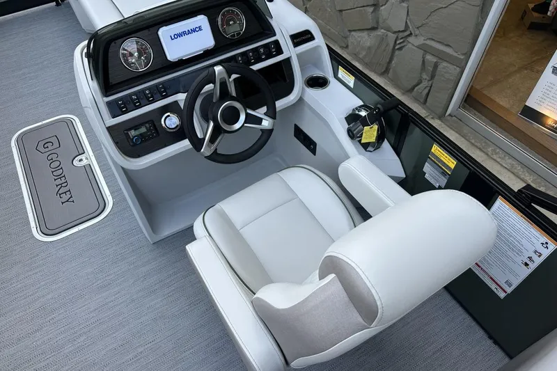 Slide: The Image of Captain's seat and dashboard of 2026 Godfrey Sweetwater 2286 SBC pontoon boat. - 7