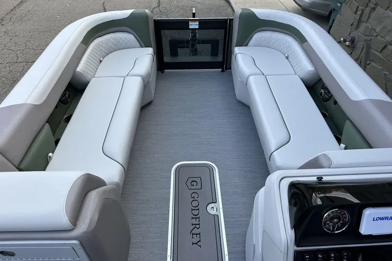 Slide: The Image of 2026 Godfrey Sweetwater 2286 SBC pontoon boat interior with luxurious seating and modern design. - 8