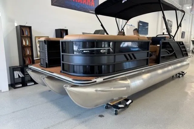 Slide: The Image of 2026 Bentley Pontoons Elite 223 Swingback in showroom, featuring sleek design and modern amenities. - 2