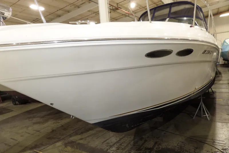 The Image of 2000 Sea Ray 340 Sundancer boat in indoor storage, side view. - 0