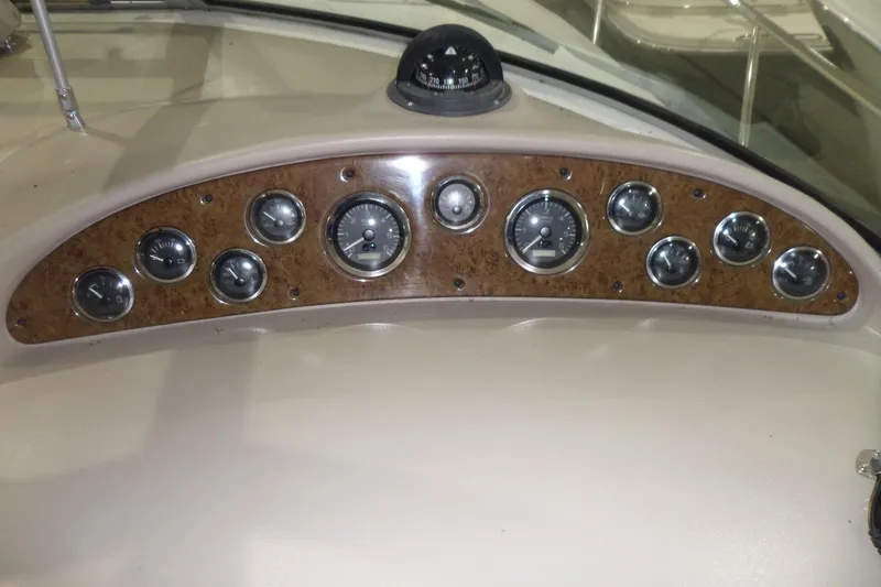 Slide: The Image of Dashboard of 2000 Sea Ray 340 Sundancer boat with gauges and compass. - 24