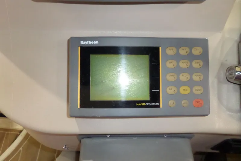 Slide: The Image of Raytheon NAV398 GPS/LORAN system on 2000 Sea Ray 340 Sundancer boat dashboard. - 26