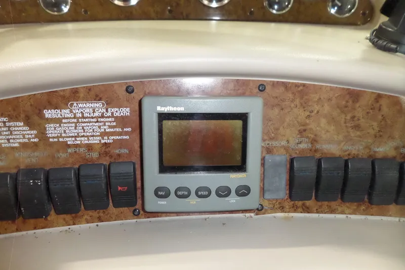 Slide: The Image of Control panel of a 2000 Sea Ray 340 Sundancer boat with Raytheon display. - 29