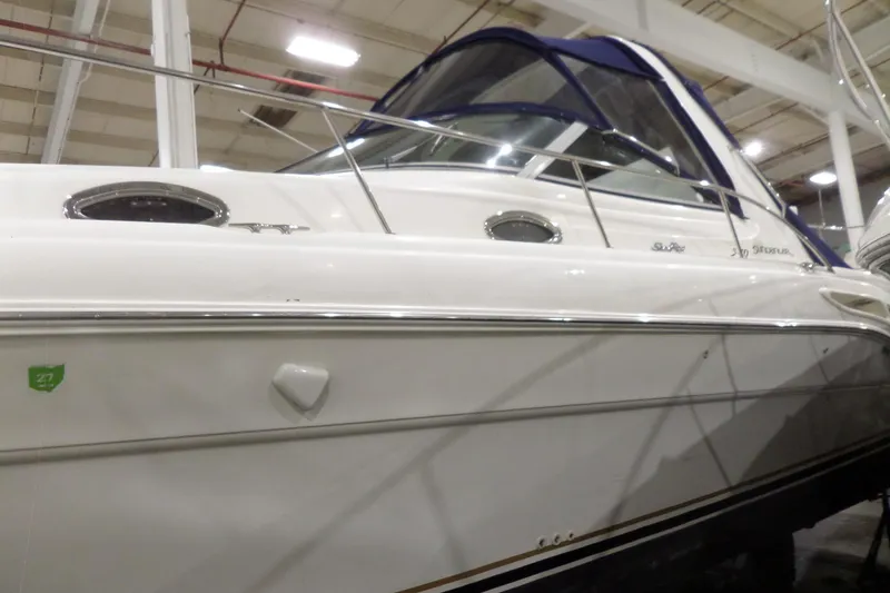 Slide: The Image of 2000 Sea Ray 340 Sundancer boat in indoor storage, side view. - 3