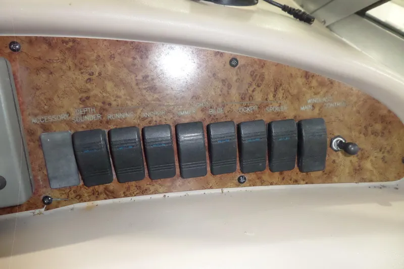 Slide: The Image of Control panel of a 2000 Sea Ray 340 Sundancer boat with labeled switches. - 30