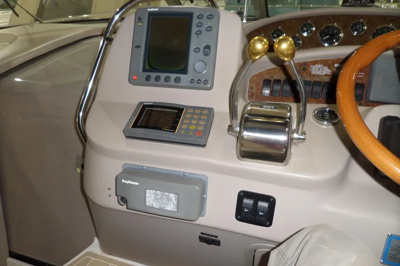 Slide: The Image of Control panel of a 2000 Sea Ray 340 Sundancer boat with navigation equipment. - 32
