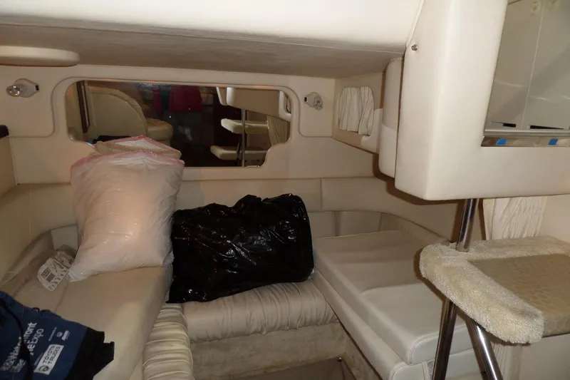 Slide: The Image of Interior cabin of a 2000 Sea Ray 340 Sundancer with seating and storage. - 36