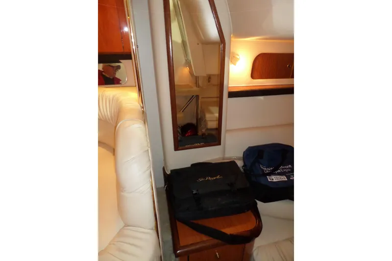 Slide: The Image of Interior of 2000 Sea Ray 340 Sundancer with leather seating and wooden accents. - 38