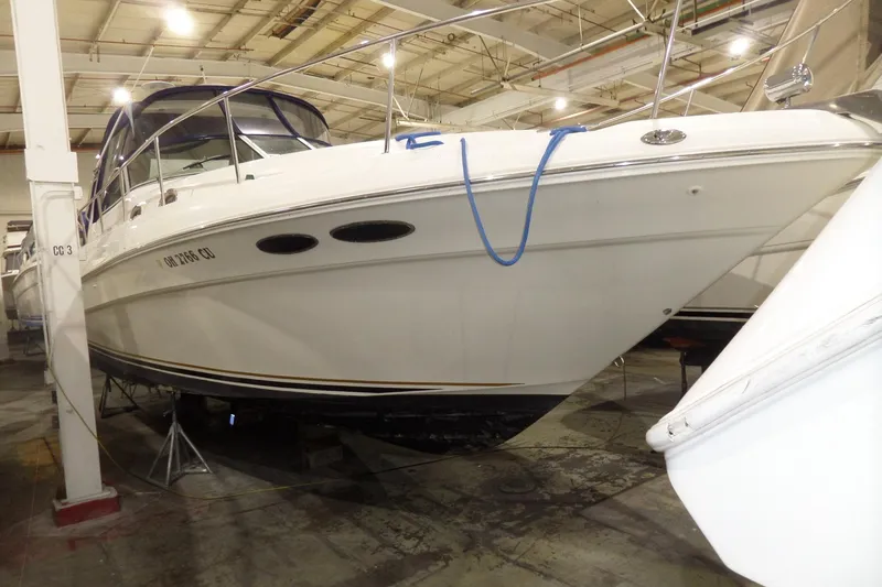 Slide: The Image of 2000 Sea Ray 340 Sundancer yacht in indoor storage facility. - 4