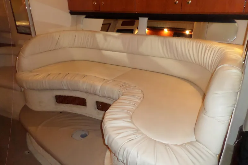 Slide: The Image of Interior of 2000 Sea Ray 340 Sundancer with plush cream seating. - 40