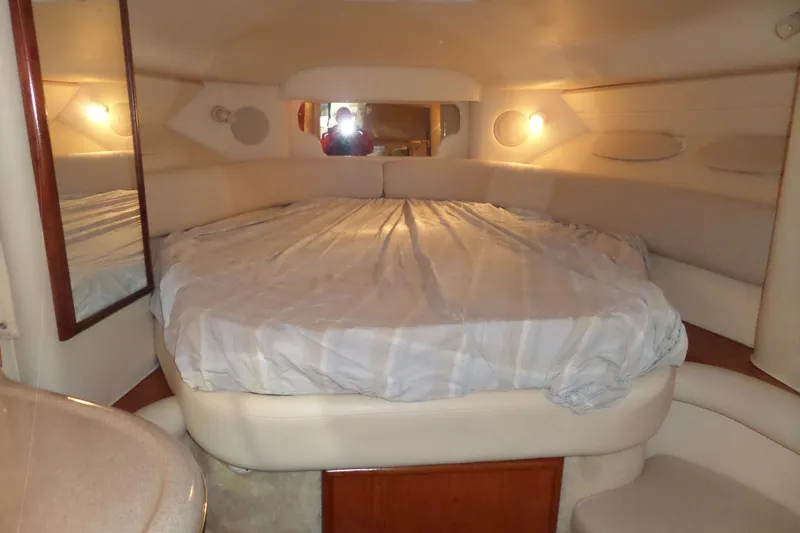 Slide: The Image of Interior cabin of 2000 Sea Ray 340 Sundancer with cozy bed and ambient lighting. - 43