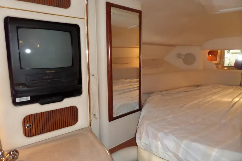 Slide: The Image of Interior of 2000 Sea Ray 340 Sundancer with TV, mirror, and bed. - 45